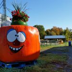 funny orange character made of large hay bale