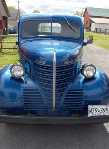 front view of old blue pickup truck